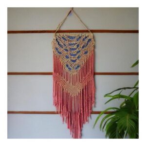 A boho chic macramé wall hanging made of knotted ropes in various patterns and designs.